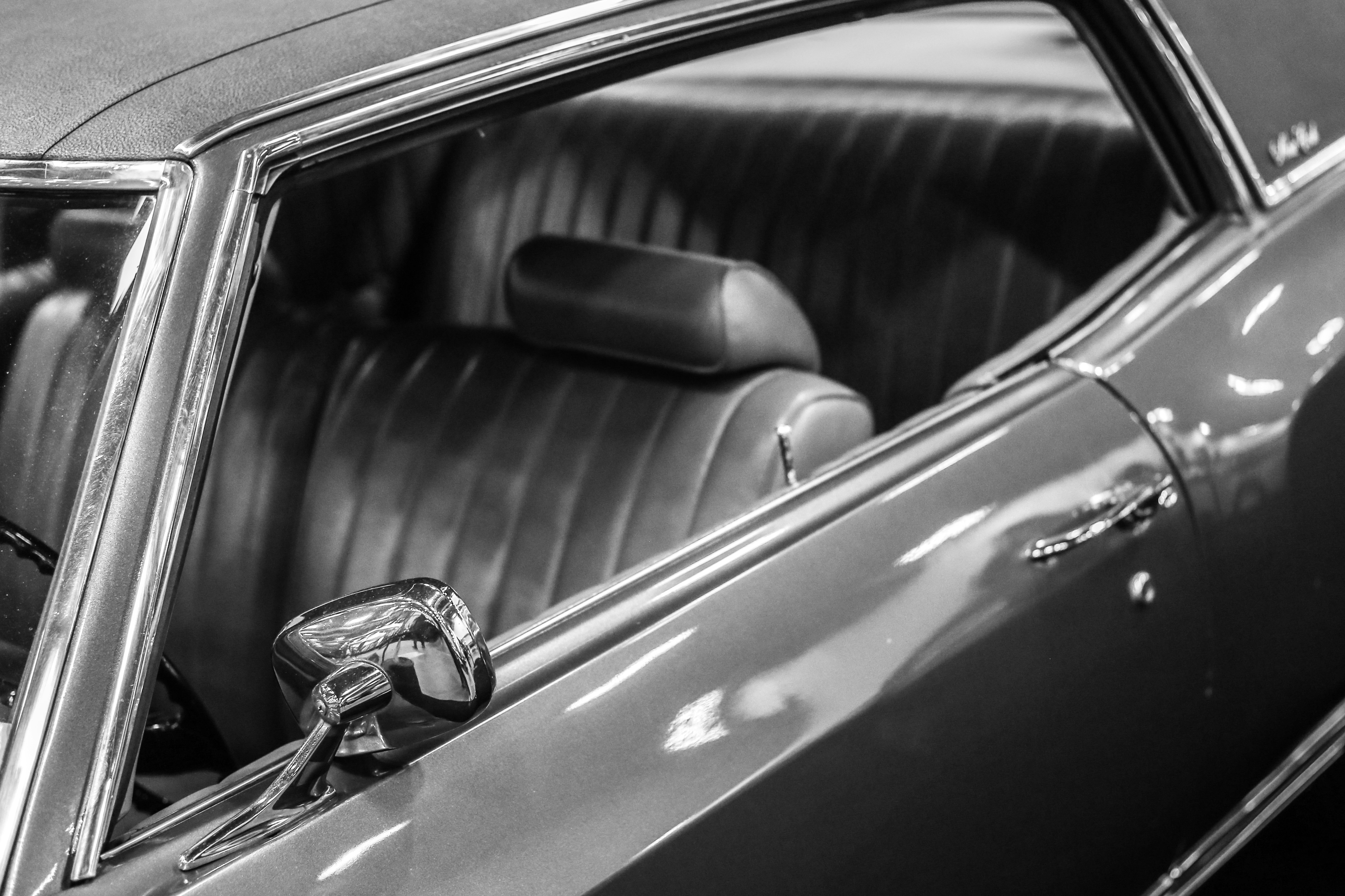 a black and white photo of a car's interior
