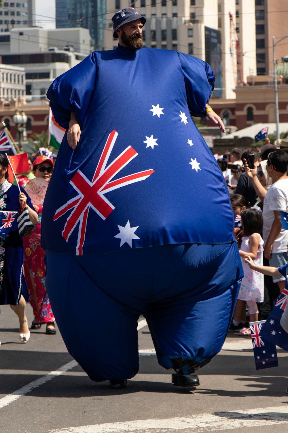 a man in an inflatable costume walking down a street
