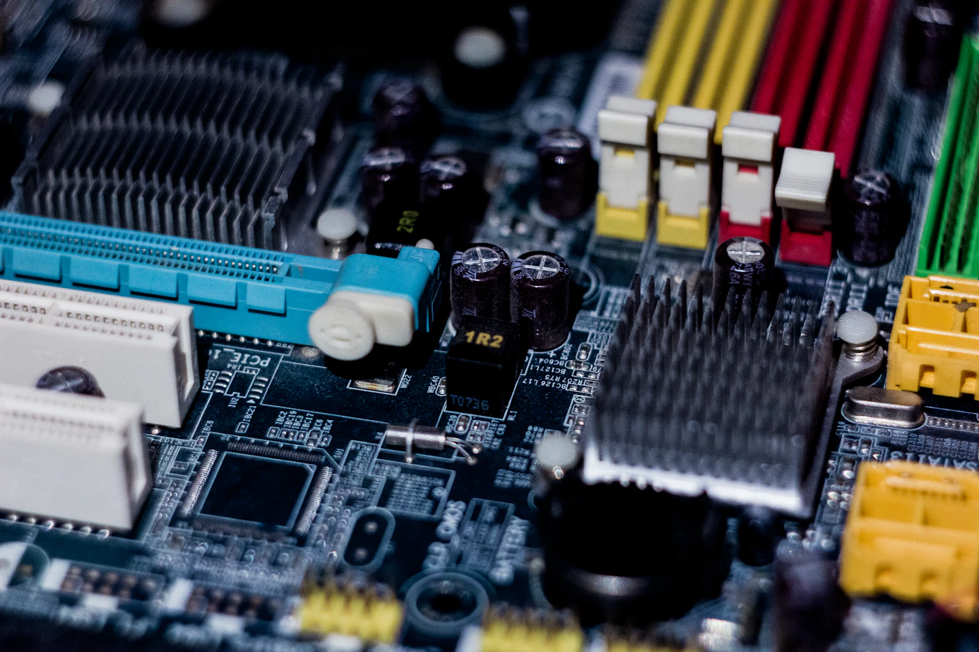 Computer motherboard being inspected for repair