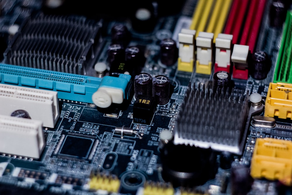 a close up of a motherboard with wires and connectors