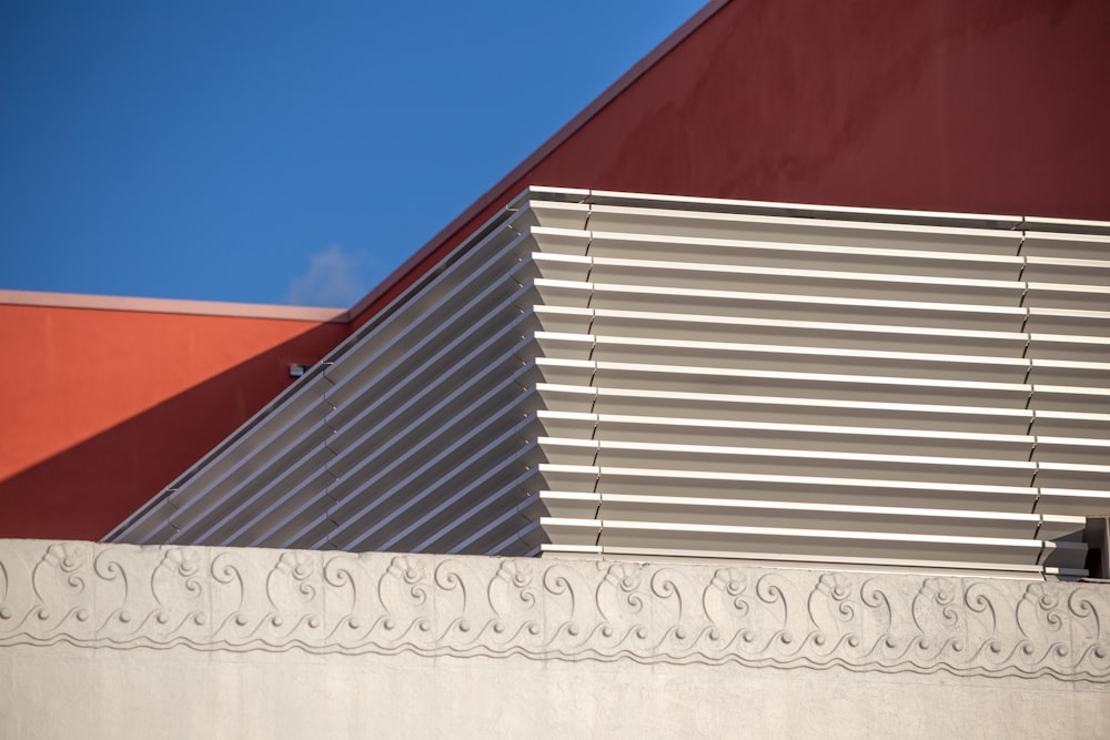 a close up of a building with a sky in the background