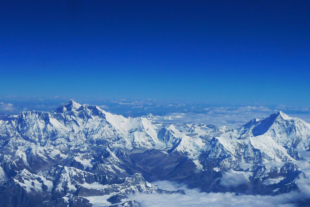 snow covered mountain under blue sky during daytime