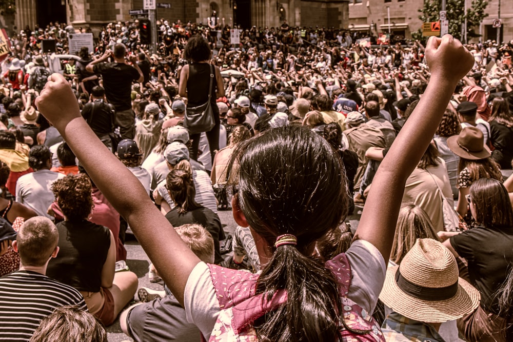 a large crowd of people in a city square