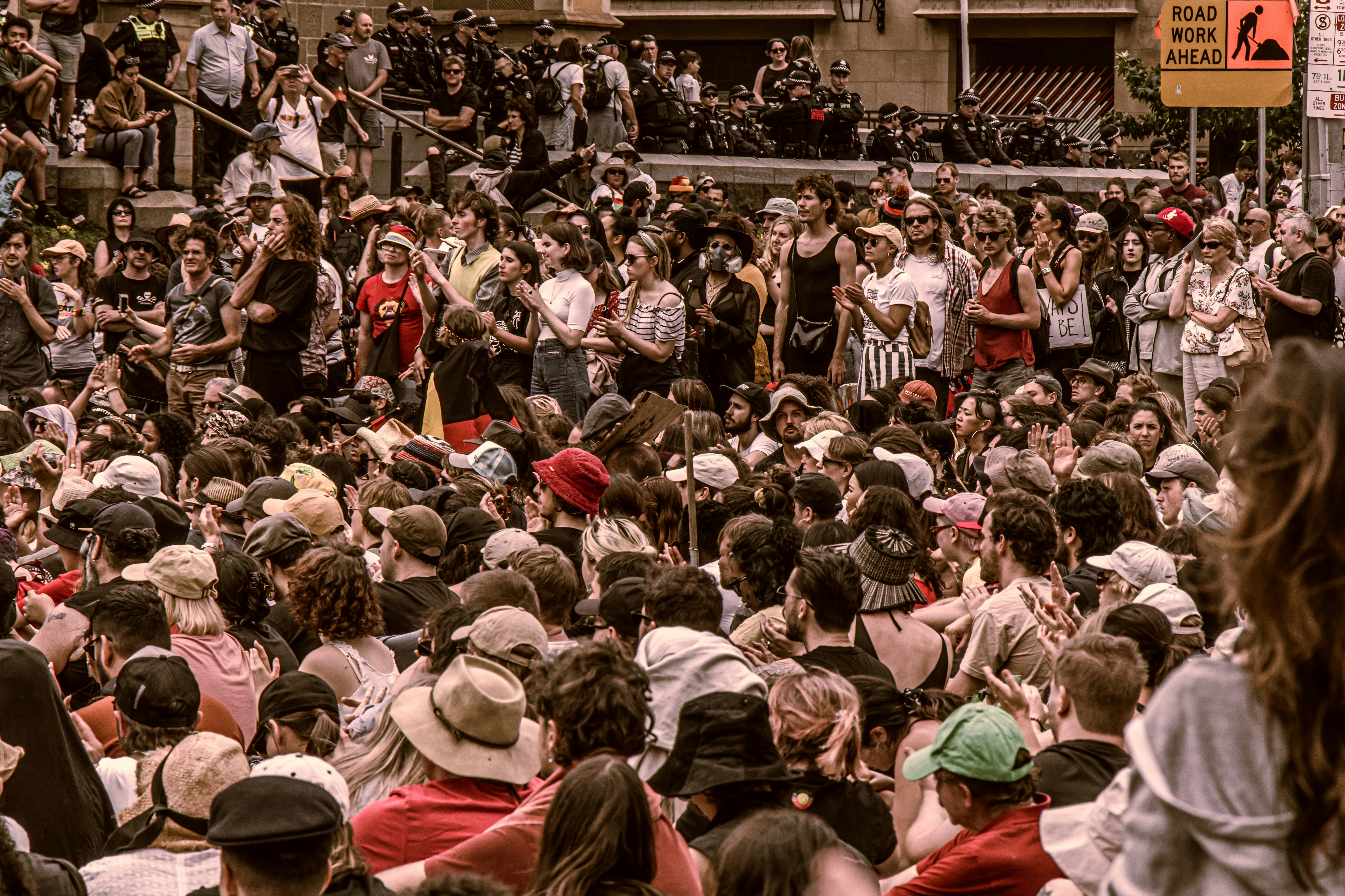 Australia Day/Invasion Day protest at Flinders Street Station Intersection. The protest also mentiones topics about bush fire and climate change.

I use high contrast, warm color and low saturation to reflect the black, red and yellow color on the aboriginal flag.
