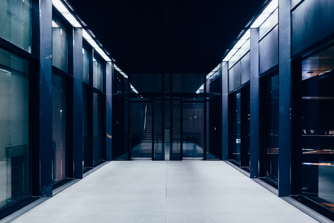 A server room corridor with rows of racks