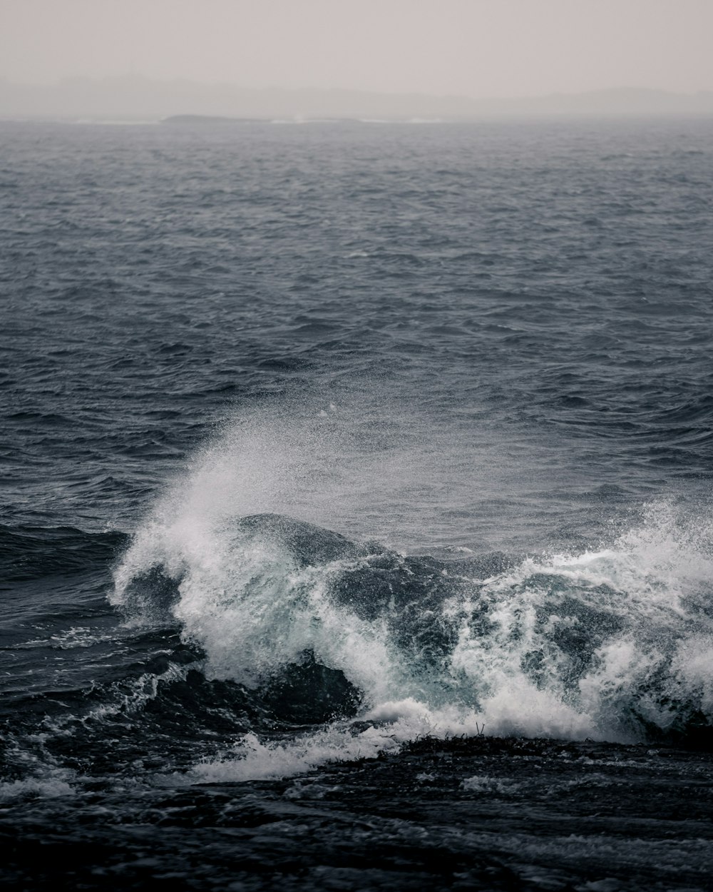 a man riding a wave in the ocean