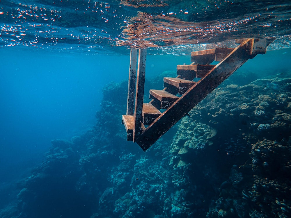 a wooden staircase going up into the ocean