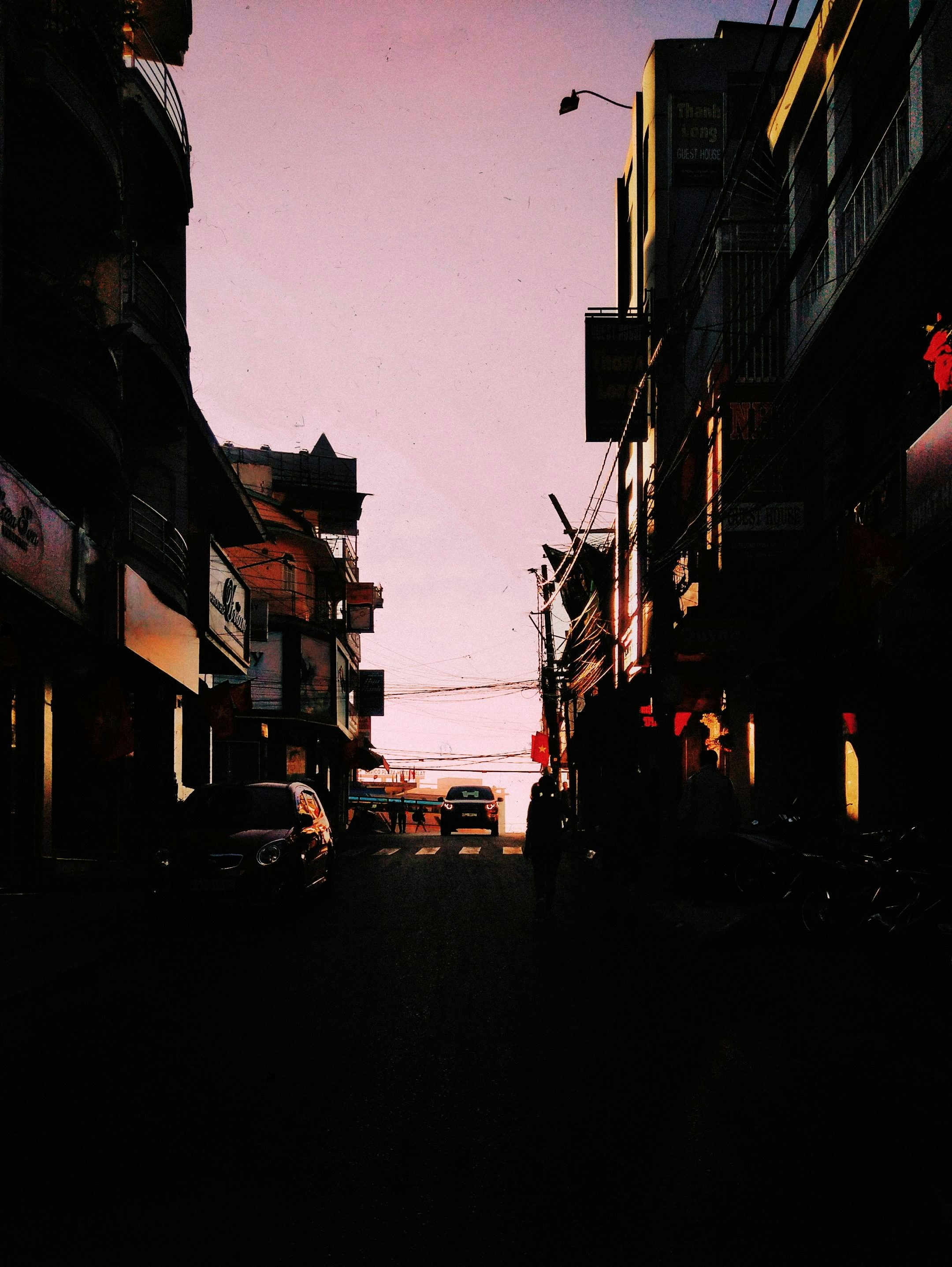 cars parked on side of the road during night time