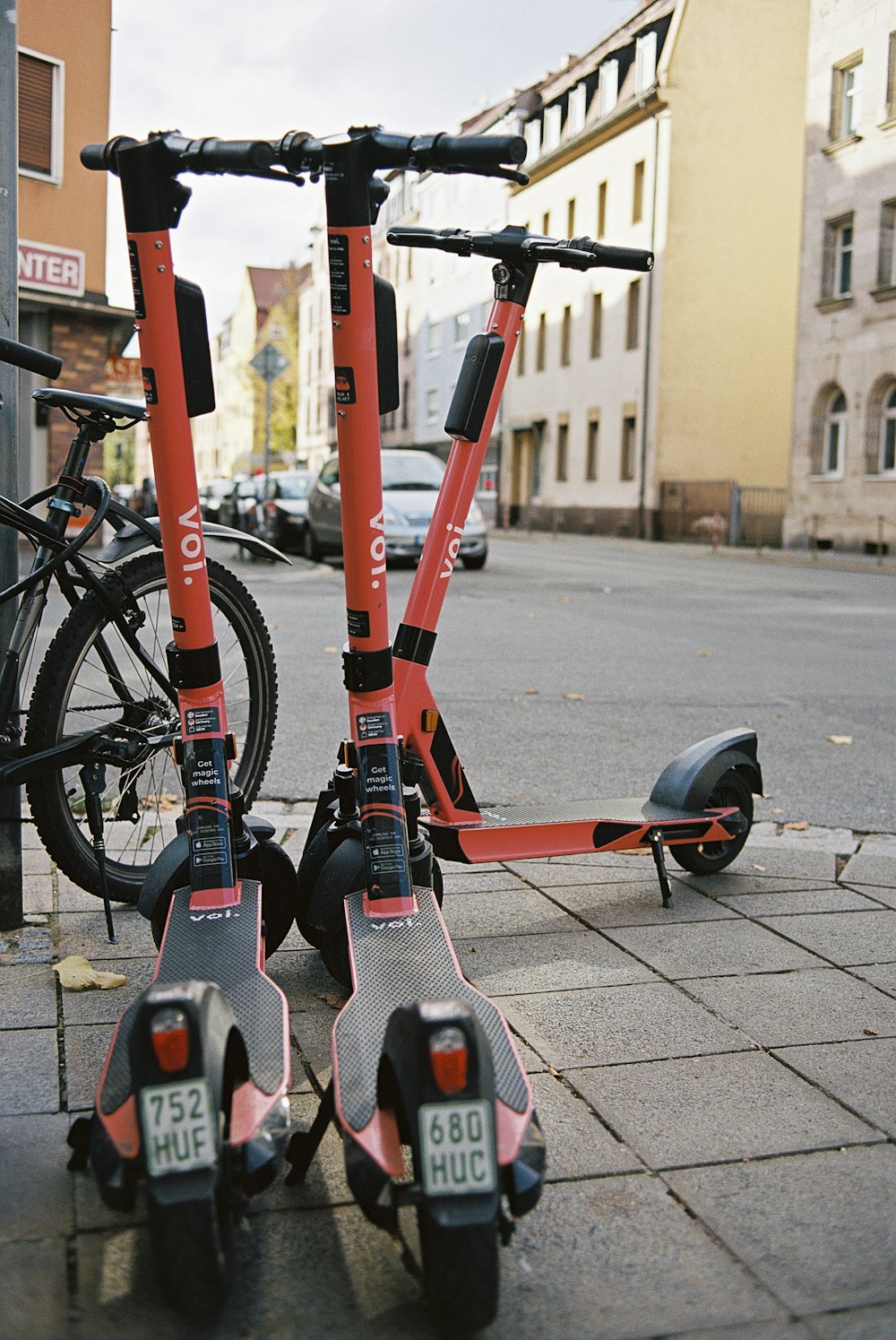 red and black bicycle on road during daytime