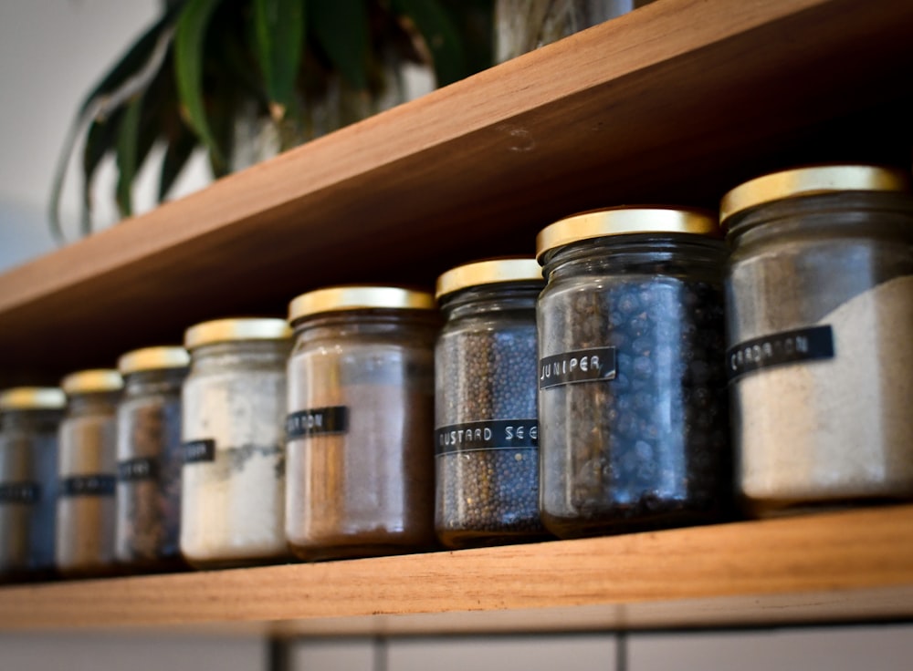 a shelf filled with lots of different types of spices