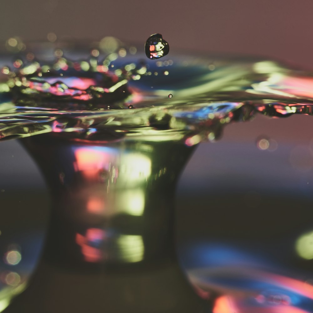 a close up of a water drop on a table