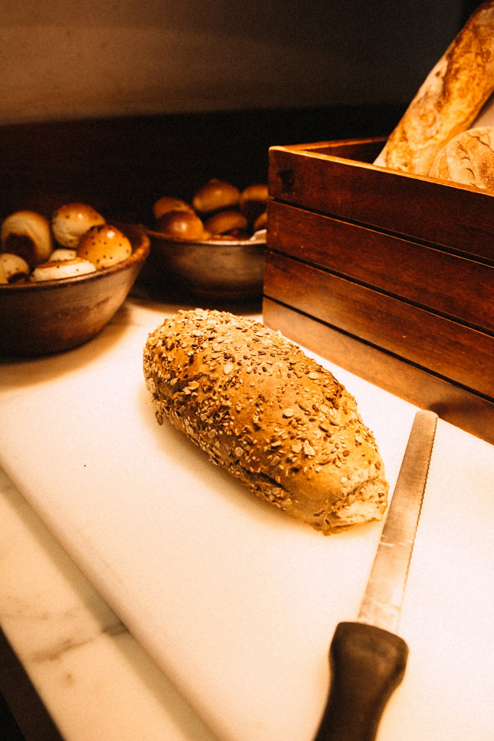 a loaf of bread sitting on top of a cutting board