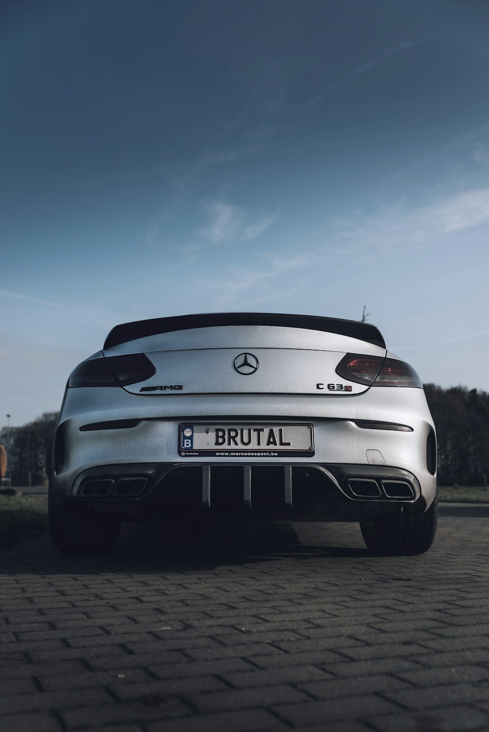 gray bmw car on road during daytime