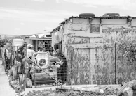 Local families gathered around a newly built shelter, sharing a moment of hope.
