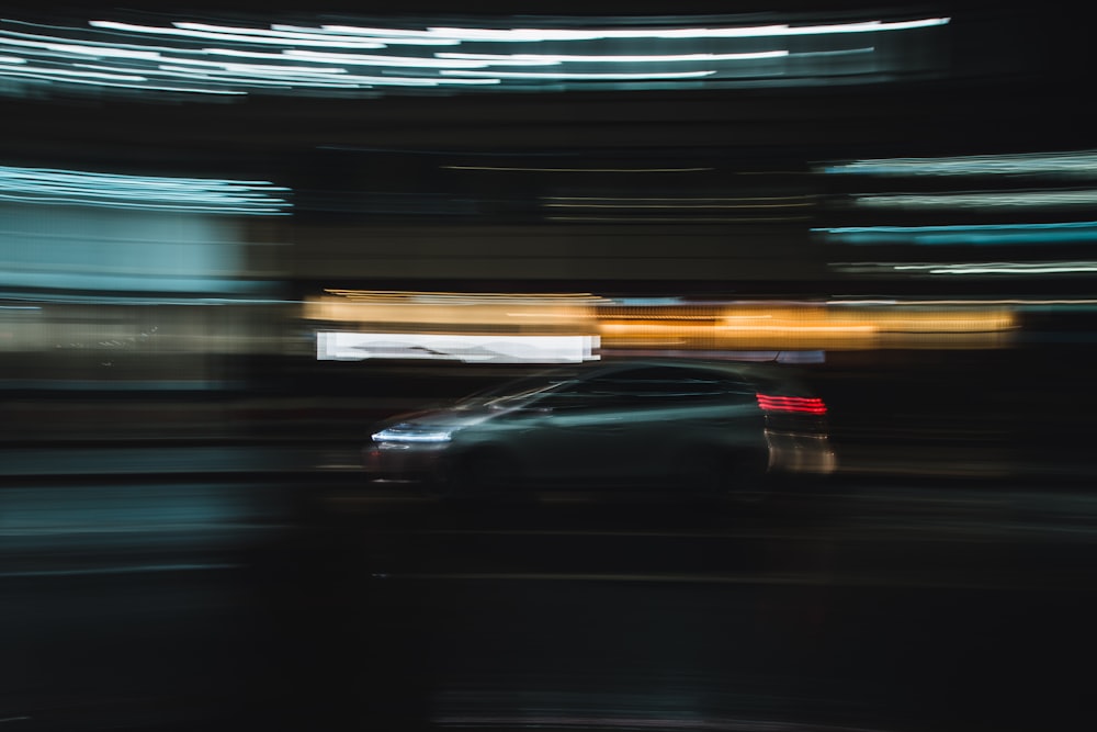 black car on road during night time