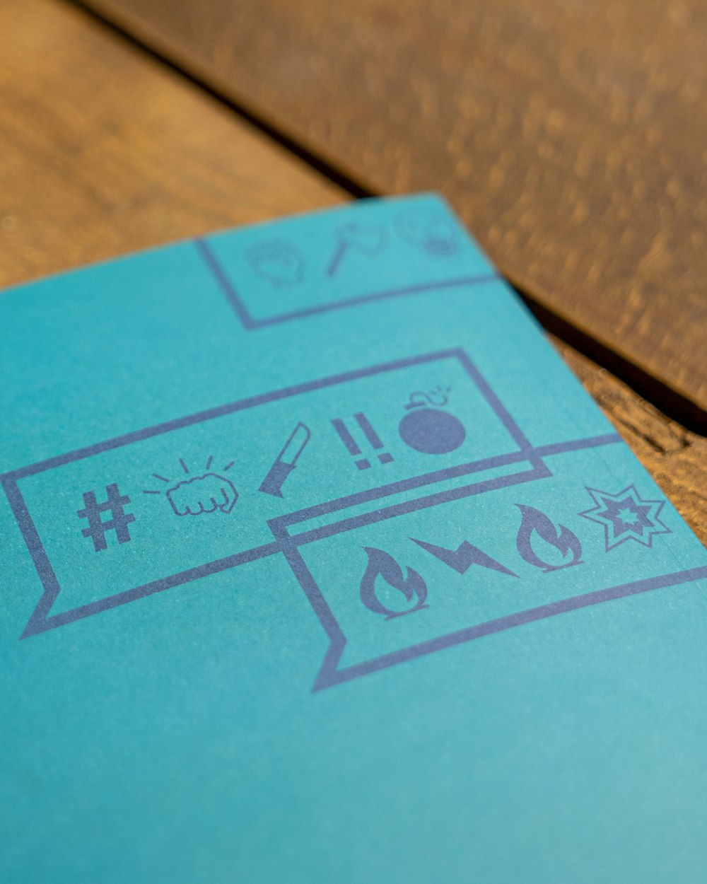 a blue book sitting on top of a wooden table