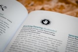 A document open to a page in German, featuring headings and text about blocking or deleting content, with an icon of a hand in a stop sign above the heading.