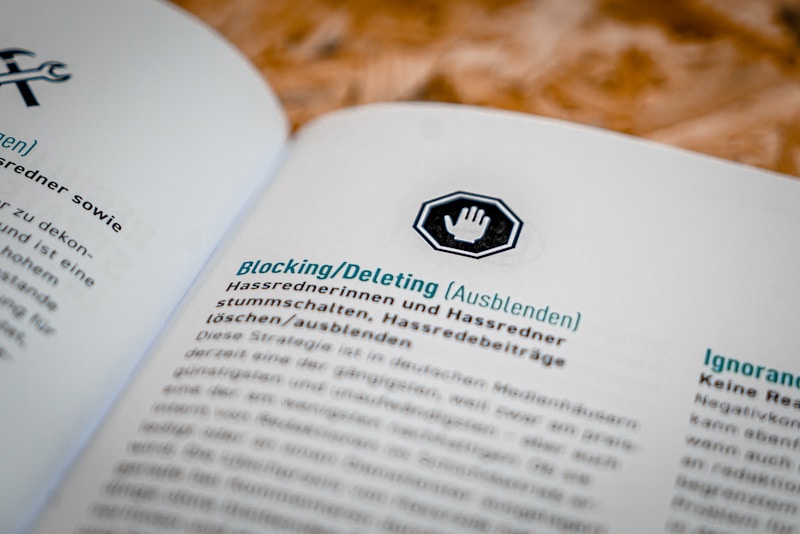 A document open to a page in German, featuring headings and text about blocking or deleting content, with an icon of a hand in a stop sign above the heading.