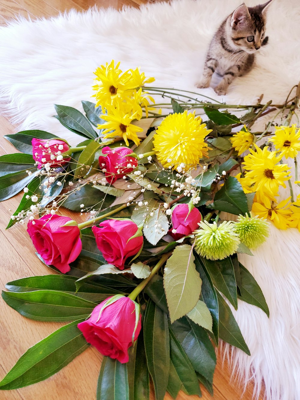 yellow and red flowers on white textile