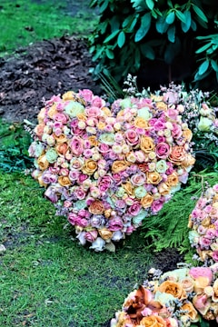 A serene landscape with a heart-shaped arrangement of flowers.