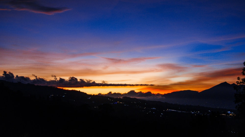 silhouette of mountains during sunset