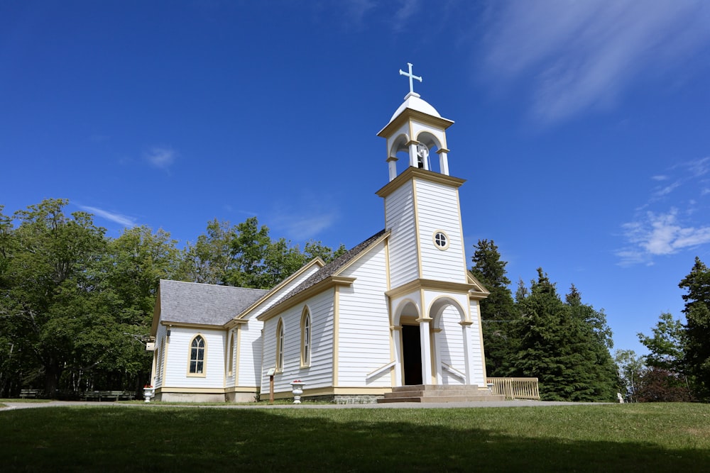 a white church with a cross on top of it