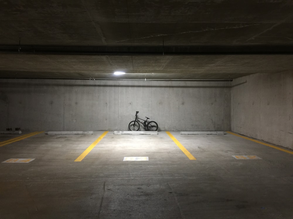 black motorcycle parked on tunnel