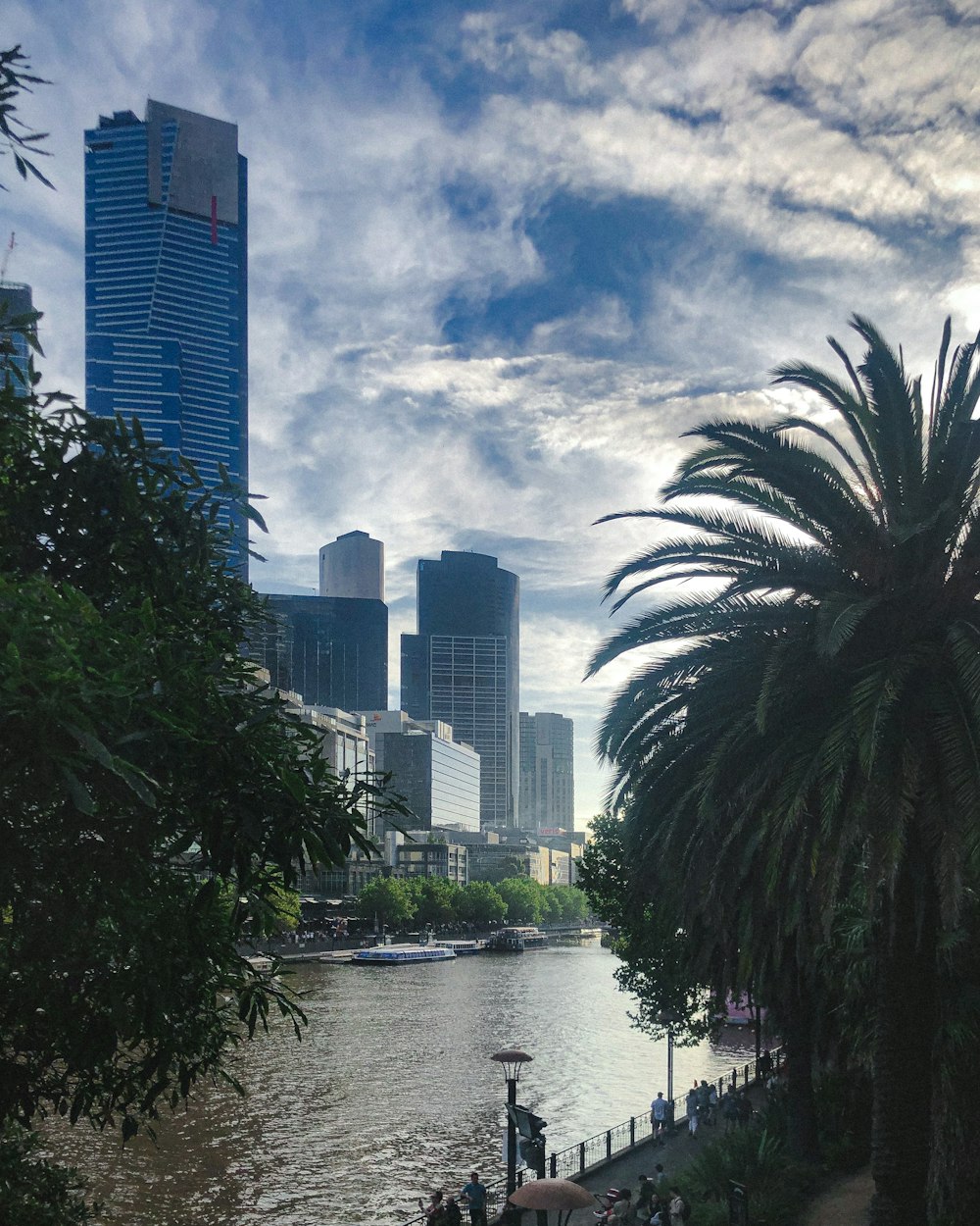 a river running through a city next to tall buildings