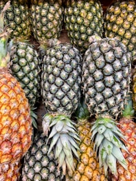 green and yellow pineapple fruits