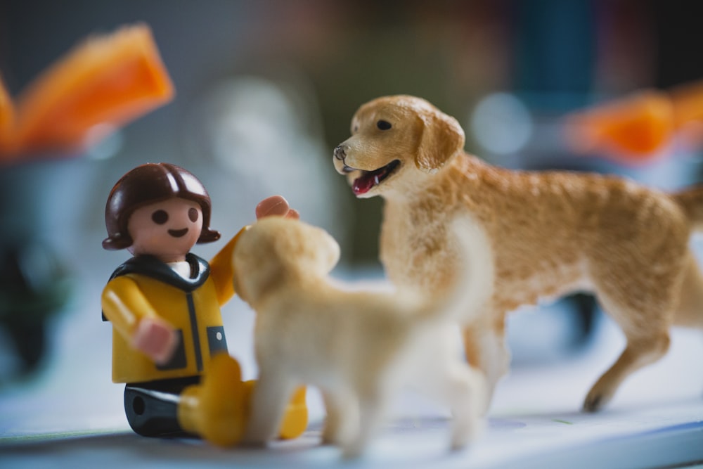 brown dog and yellow dog plastic toys