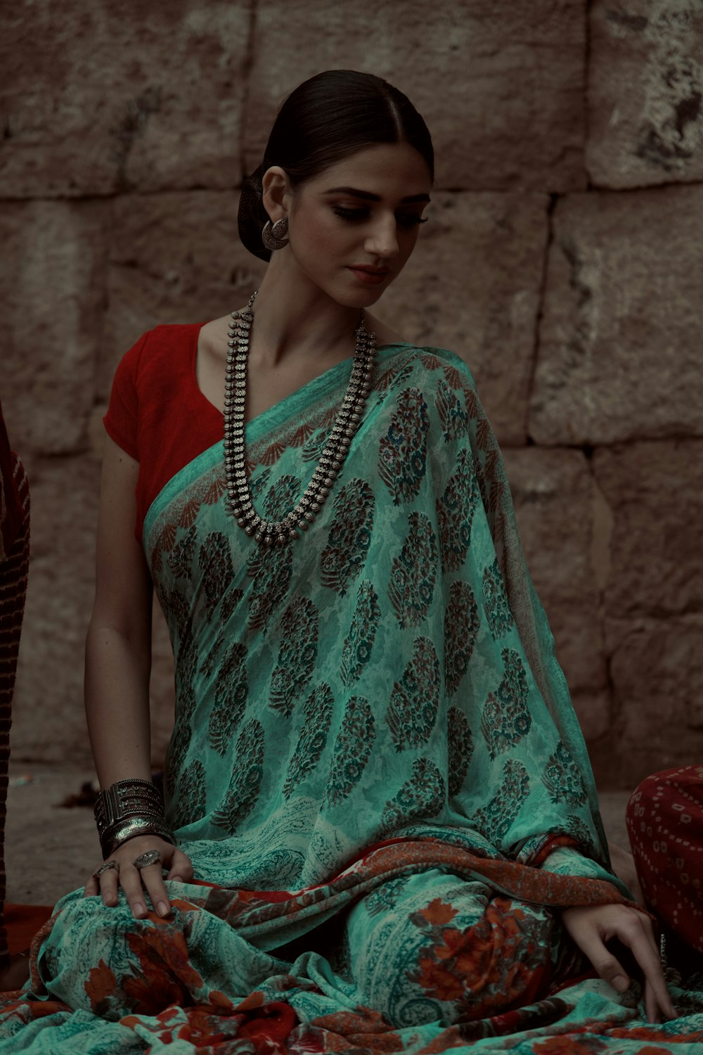 woman in green and white dress wearing black leather strap watch