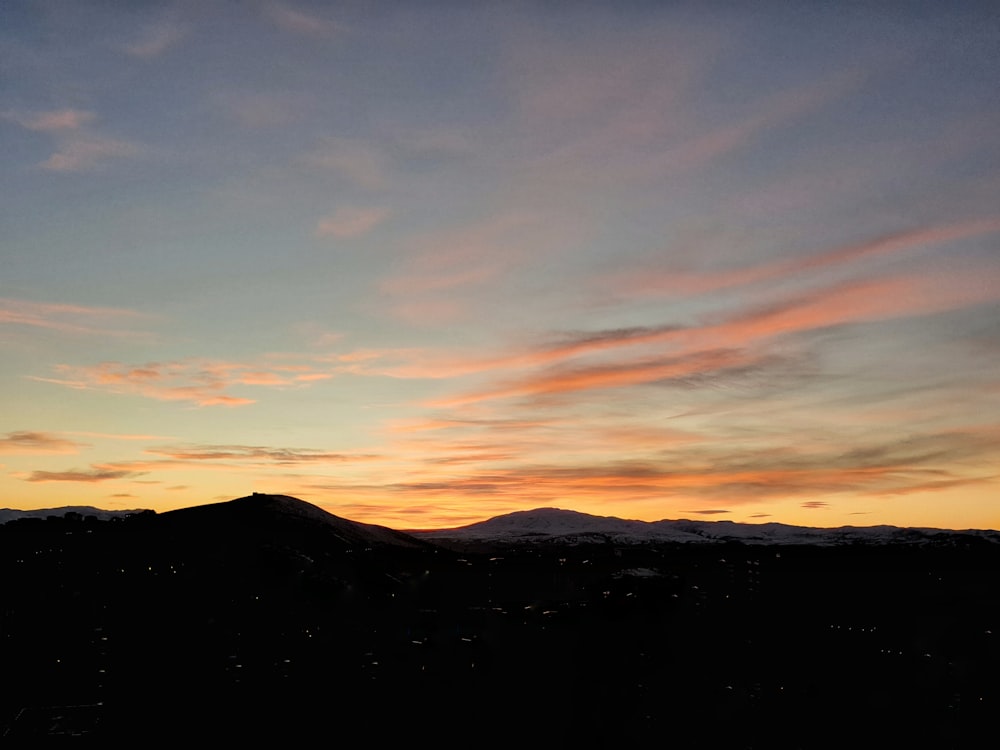 silhouette of mountain during sunset