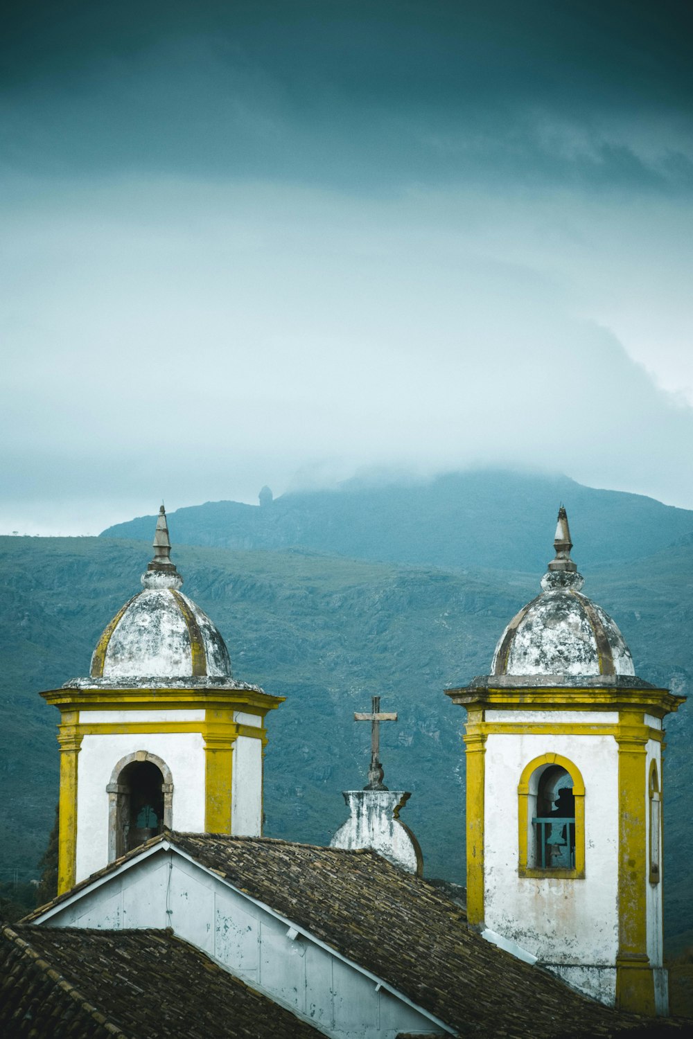 white concrete church on top of mountain