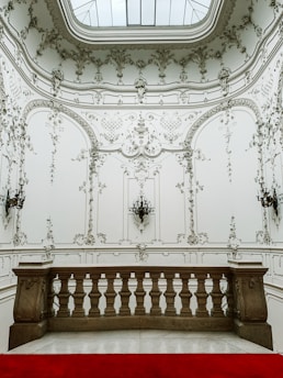 Interior room showcasing smooth plastered walls and decorative stucco finishes.