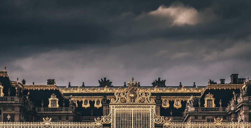 white and black concrete building under gray clouds