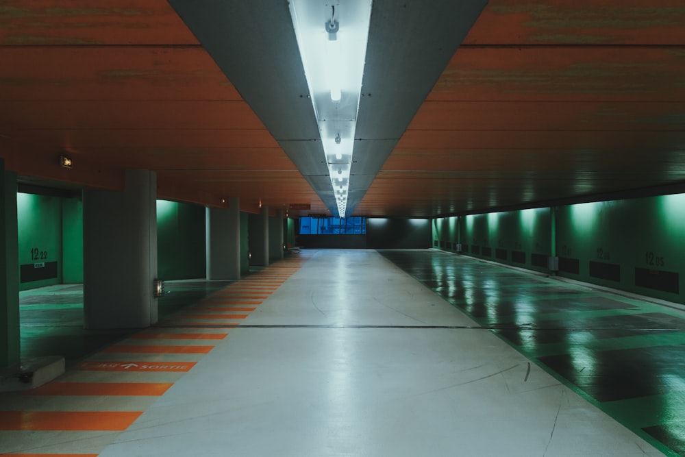 brown and green hallway with green lights