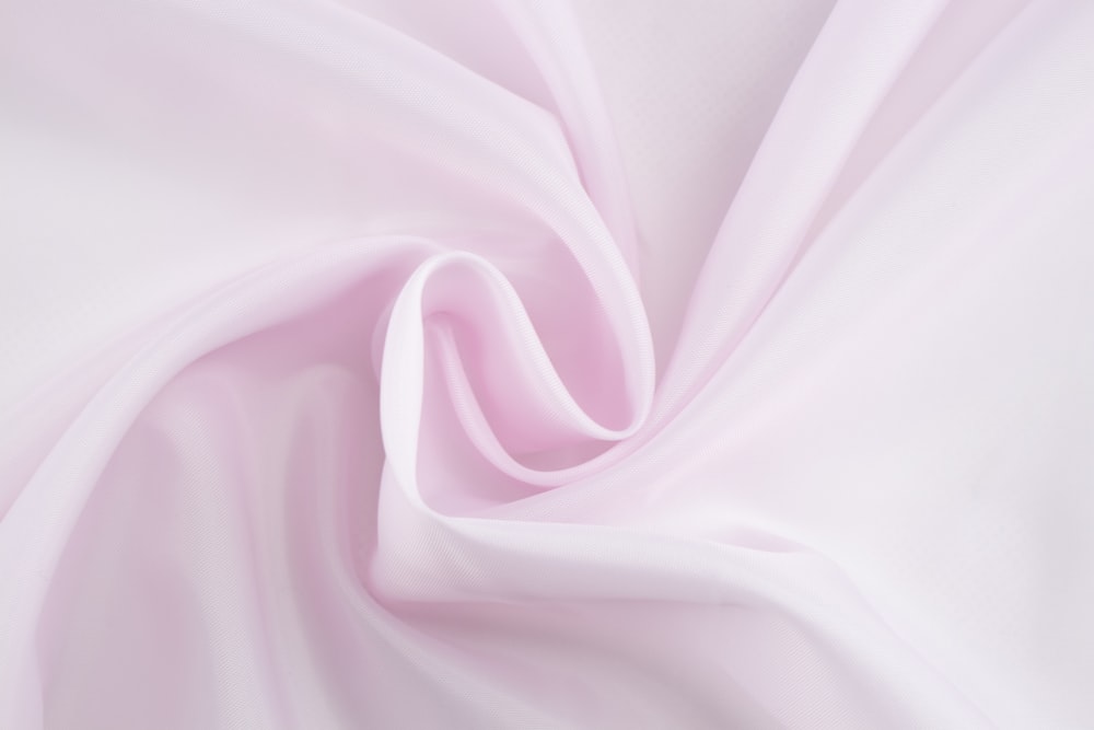 pink textile in close up photography