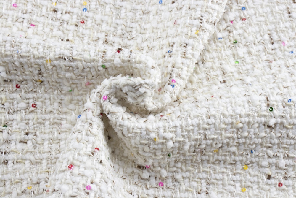 white knit textile on white textile