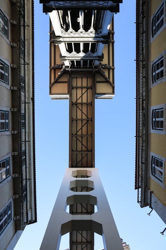 white and black street lamp in Elevador de Santa Justa Portugal