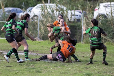 women playing rugby during daytime