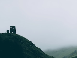 Misty landscapes of Scotland with ancient castles in the background.