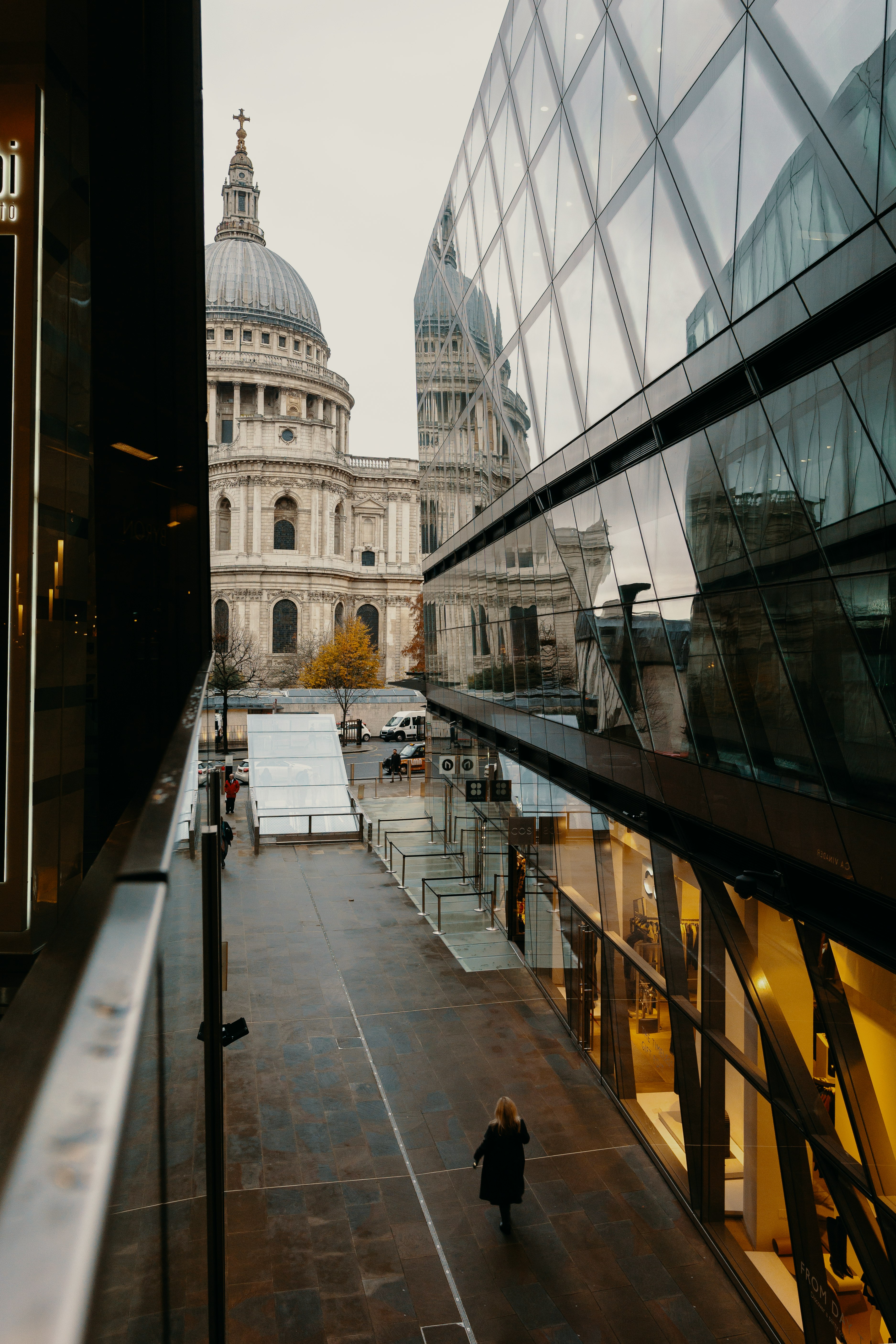 people walking on sidewalk near building during daytime