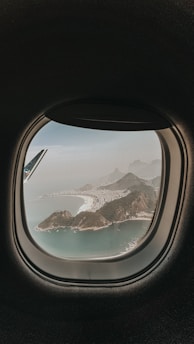 aerial view of lake and mountains during daytime