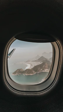 aerial view of lake and mountains during daytime