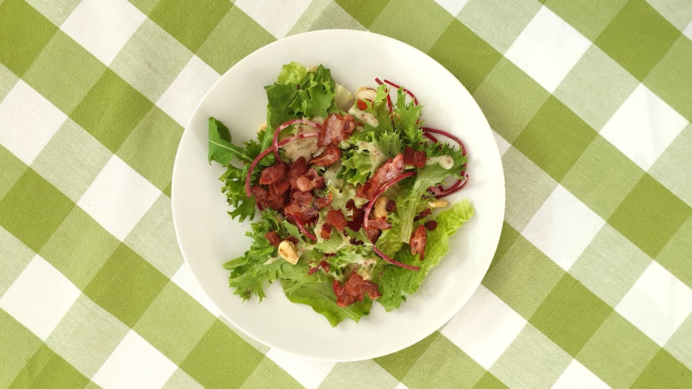 green vegetable salad on white ceramic plate