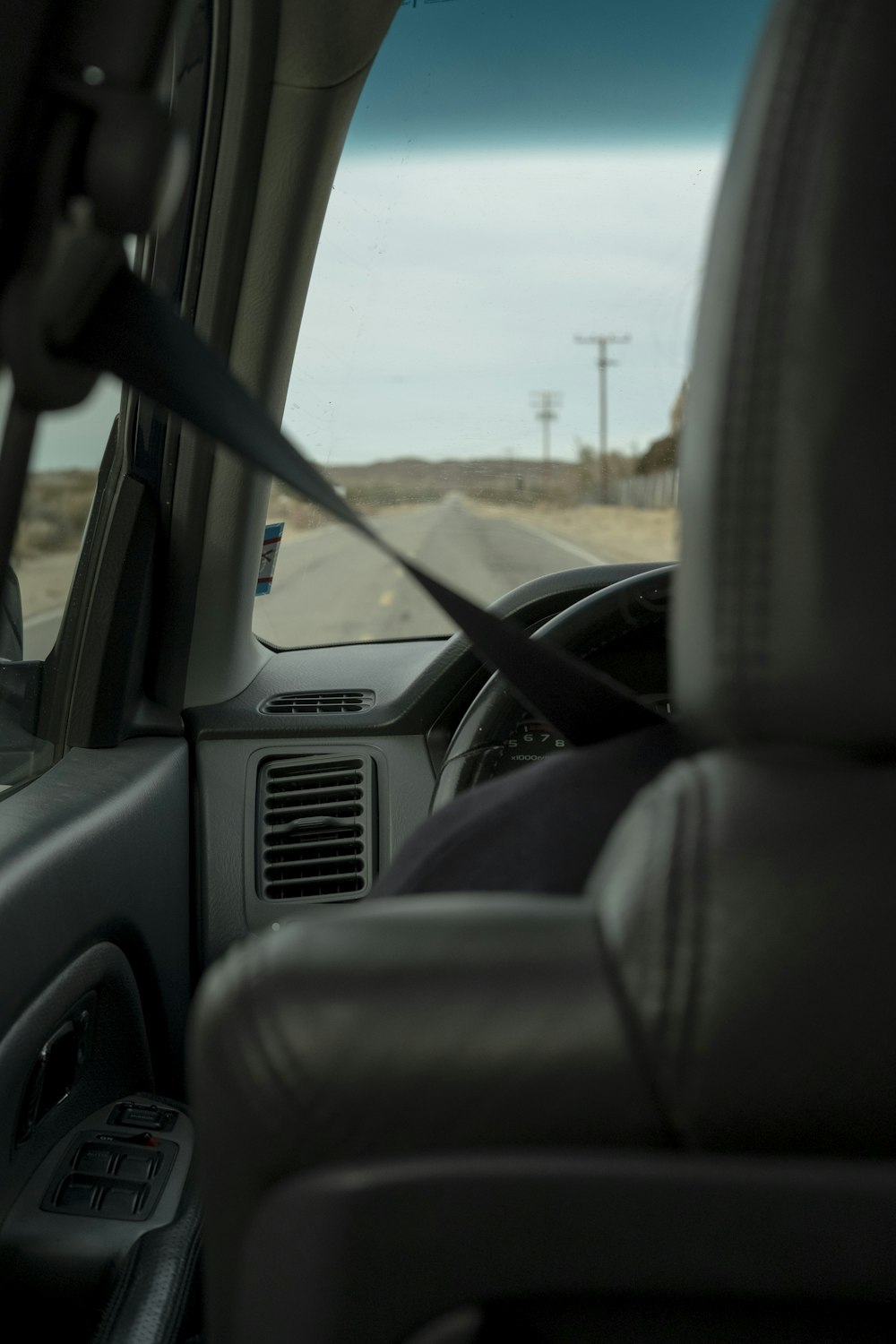 black car door with black steering wheel