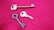 Three different keys are placed on a textured pink surface. One key is long and metallic, while another is circular with a grooved design. The third key is more traditional, with ridges and a rounded handle.