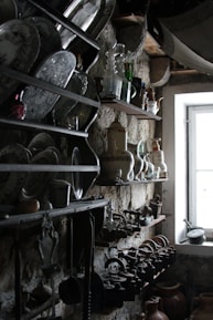 Handcrafted rustic wooden shelves filled with vintage decor in a warm home setting.