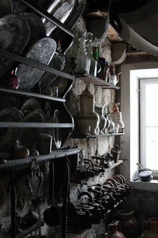 Handcrafted rustic wooden shelves filled with vintage decor in a warm home setting.