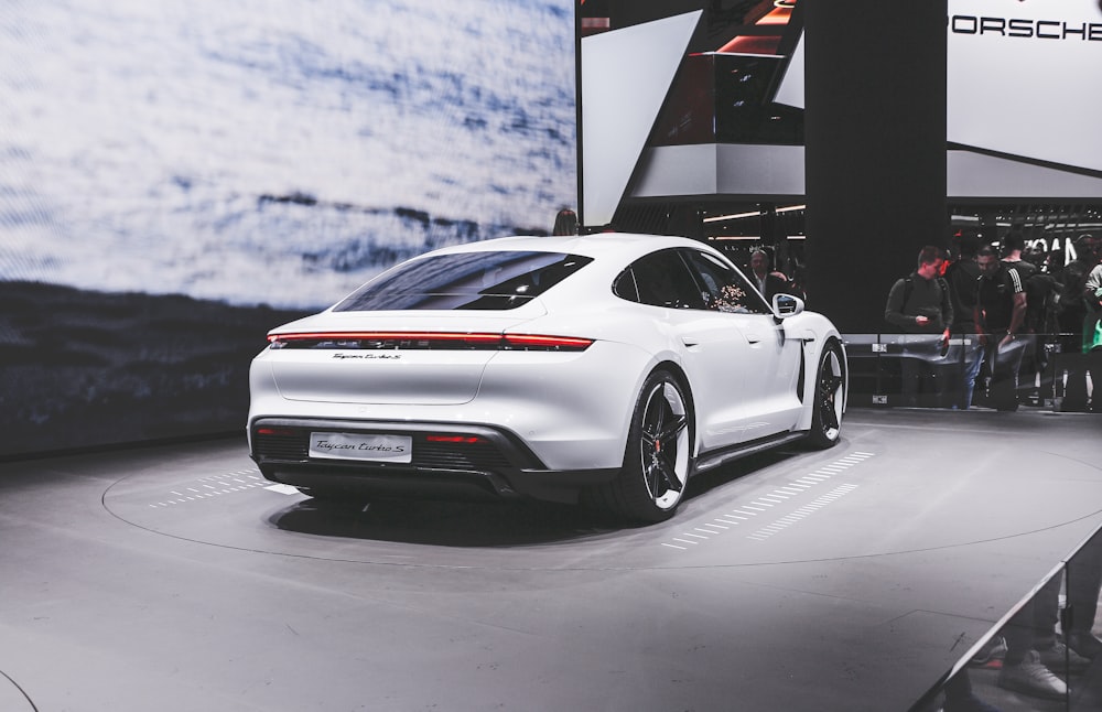 white porsche 911 on snow covered ground